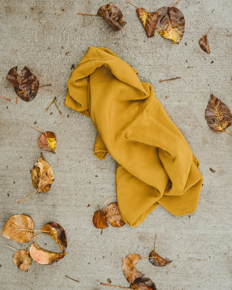 Tono + co Scout Silk Scarf in Oro. Lovingly hand-dyed in Santa Ana, California and available in 24 signature colors. Styled by Erica Kopp of Stay Co and photographed by Tess Comrie for our Fall 2018 Lookbook. Check out our website for more style and color inspiration.