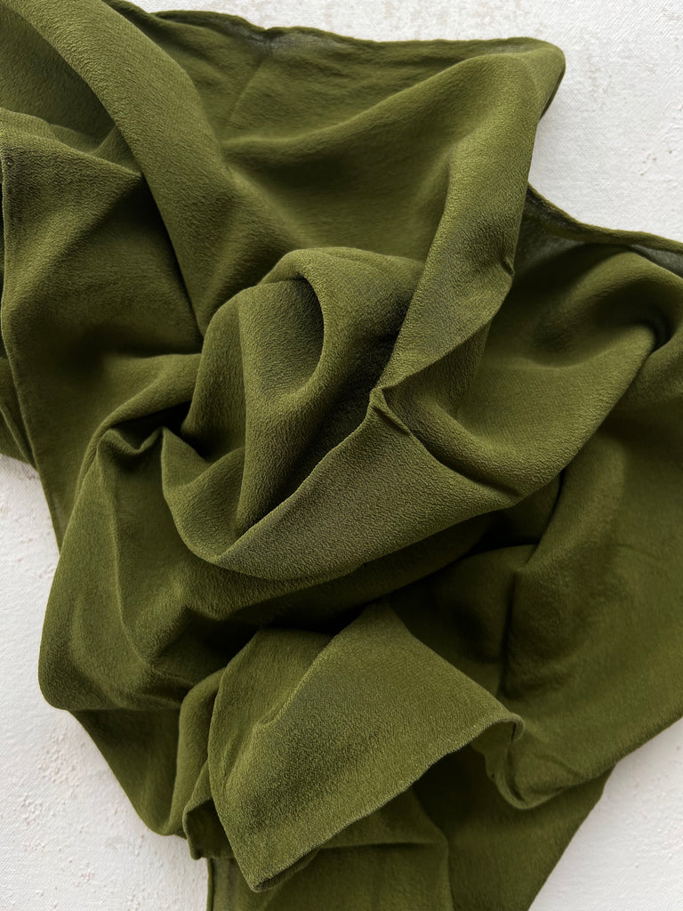 Army green scarf in a wool-silk blend