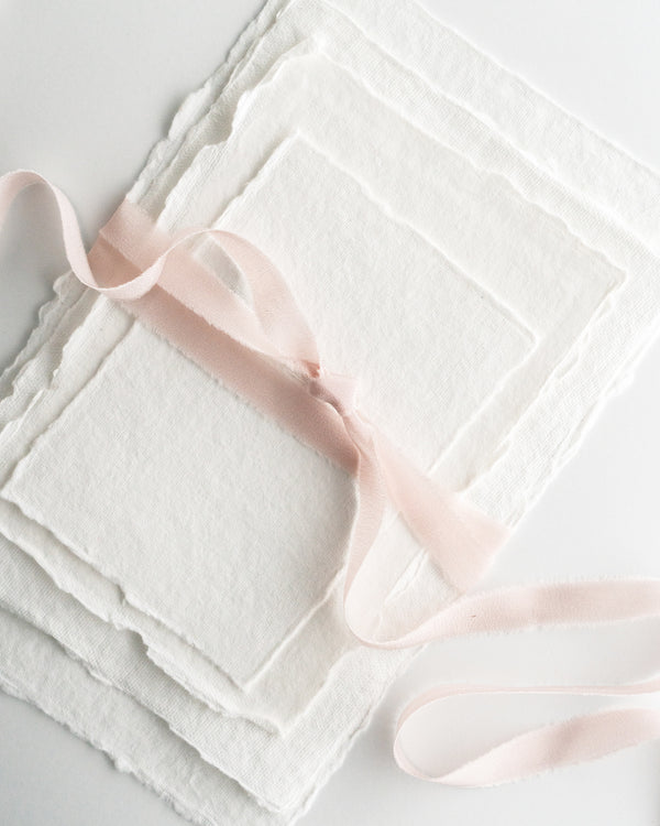 Tono + co Silk Ribbon Trim in Blush. Perfect for stationary styling, boutonnieres, and detail work. Find your inspiration through color and silk. Lovingly hand-dyed in Santa Ana, California and available in 24 signature colors. Check out our website for more styling, flat-lay, and color tips.