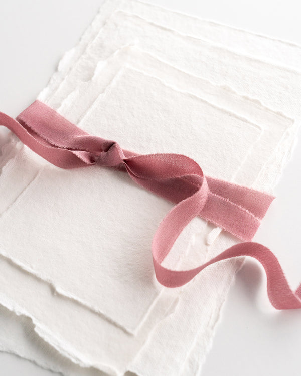 Tono + co Silk Ribbon Trim in Rose. Perfect for stationary styling, boutonnieres, and detail work. Find your inspiration through color and silk. Lovingly hand-dyed in Santa Ana, California and available in 24 signature colors. Check out our website for more styling, flat-lay, and color tips.
