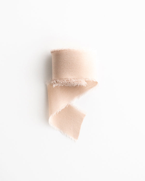 Tono + co Classic Silk Ribbon in Sand. Find your style inspiration through color and silk. Created in partnership with Artisaire wax seals. Lovingly hand-dyed in Santa Ana, California and available in 24 signature colors.