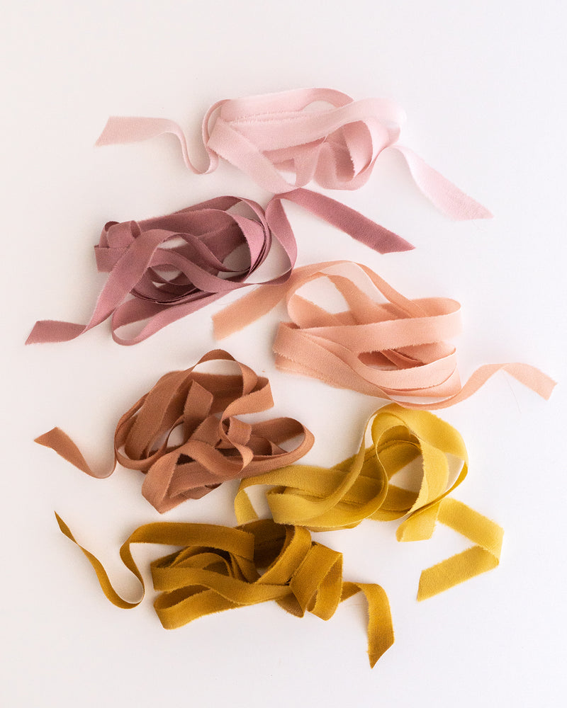 Tono + co Silk Ribbon Trim, featuring favorites from the Rouge + Earth + Golden Collections. Perfect for stationary styling, boutonnieres, and detail work. Find your inspiration through color and silk. Lovingly hand-dyed in Santa Ana, California and available in 24 signature colors. Check out our website for more styling, flat-lay, and color tips.