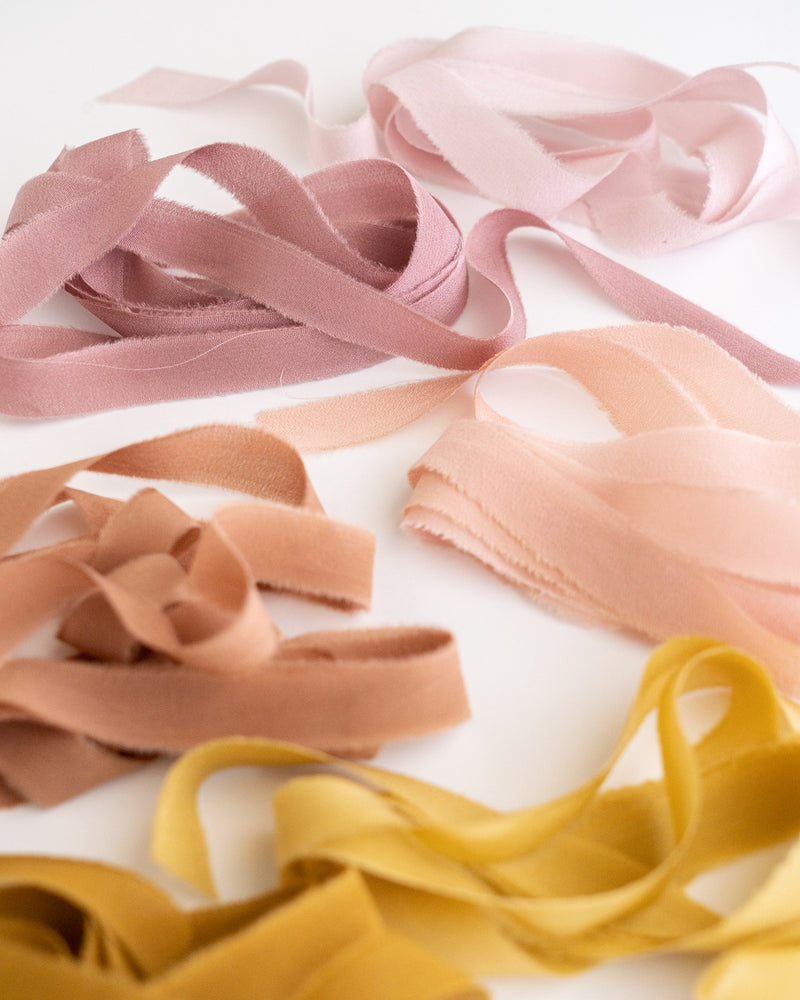 Tono + co Silk Ribbon Trim, featuring favorites from the Rouge + Earth + Golden Collections. Perfect for stationary styling, boutonnieres, and detail work. Find your inspiration through color and silk. Lovingly hand-dyed in Santa Ana, California and available in 24 signature colors. Check out our website for more styling, flat-lay, and color tips.