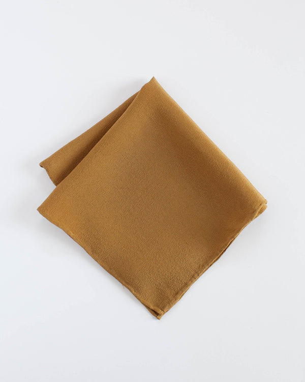 The Tono + co Silk Hankie in Oro is the perfect everyday accessory. Versatile and functional, it can be used as a pocket square, napkin, bandana, or a traditional hankie. Lovingly hand-dyed in Santa Ana, California and available in 24 signature colors. Check our our website for more color, styling, and lookbook inspiration.