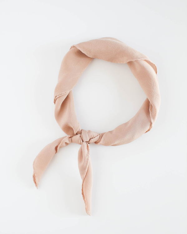 Tono + co Scout Silk Scarf in Peach. The perfect accessory for everyday styling. Lovingly hand-dyed in Santa Ana, California and available in 24 signature colors.