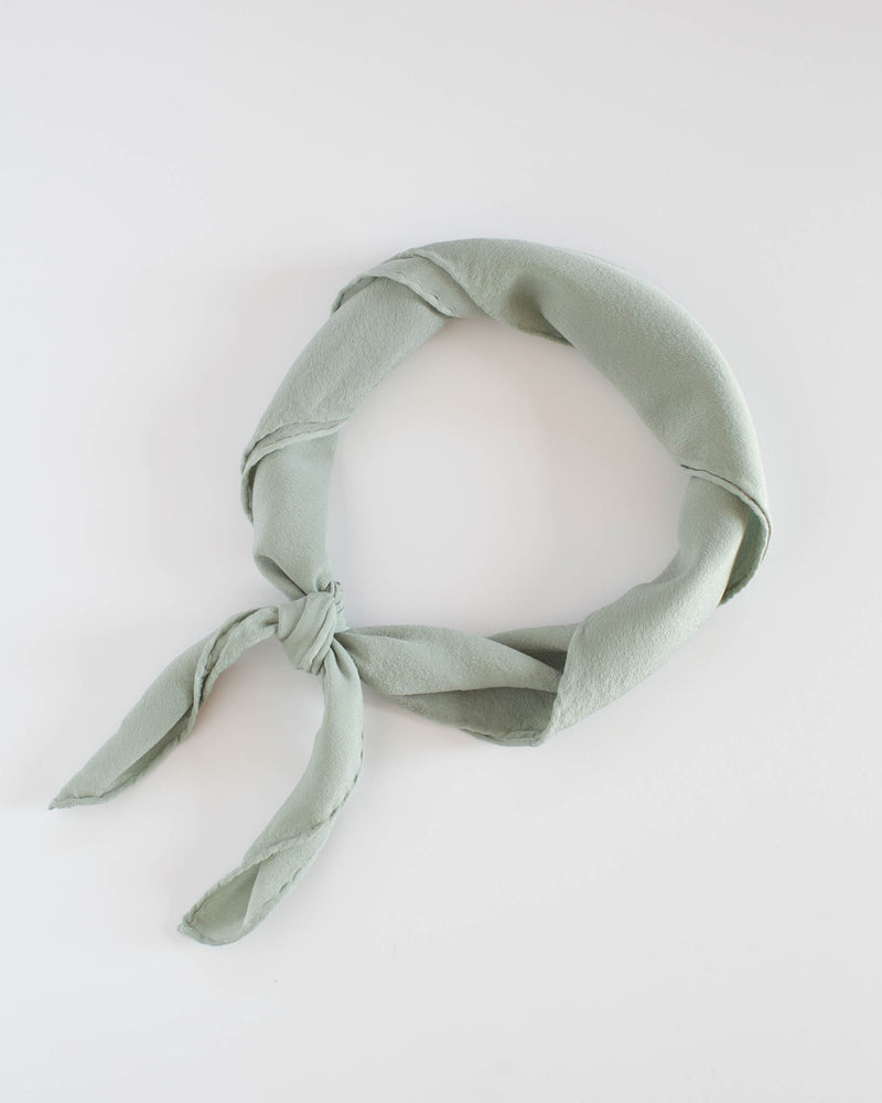 Tono + co Scout Silk Scarf in Sage. Lovingly hand-dyed in Santa Ana, California and available in 24 signature colors. Check out our website for more style, fashion, and lookbook inspiration.
